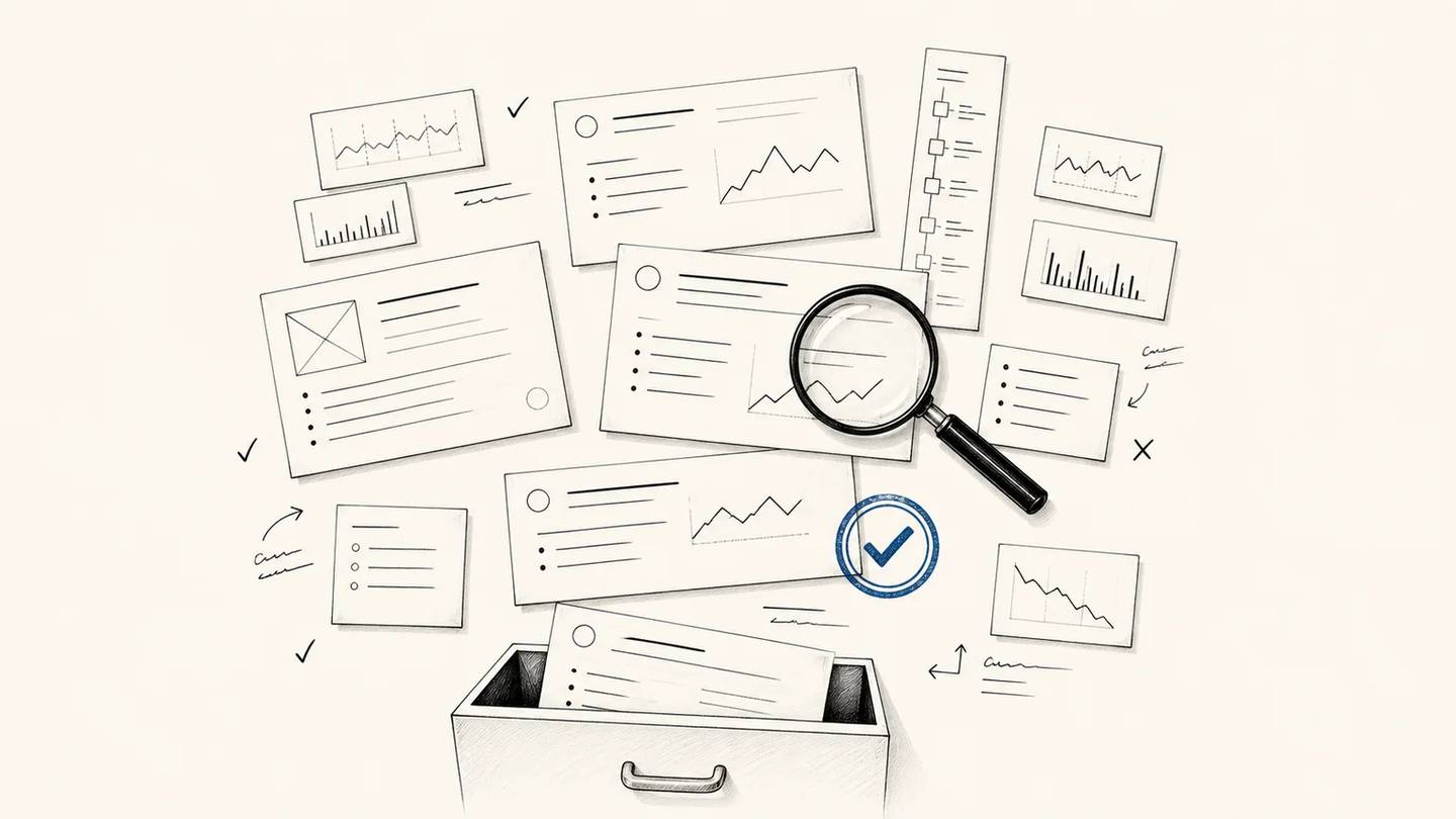 Article cards are reviewed with a magnifier before being kept, revised, or filed away