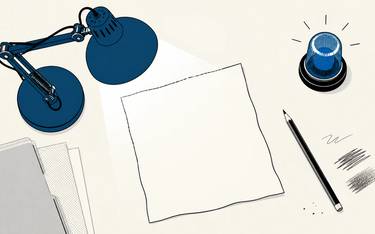 A blue desk lamp and lit alert beacon sit beside a blank sheet of paper and pencil.